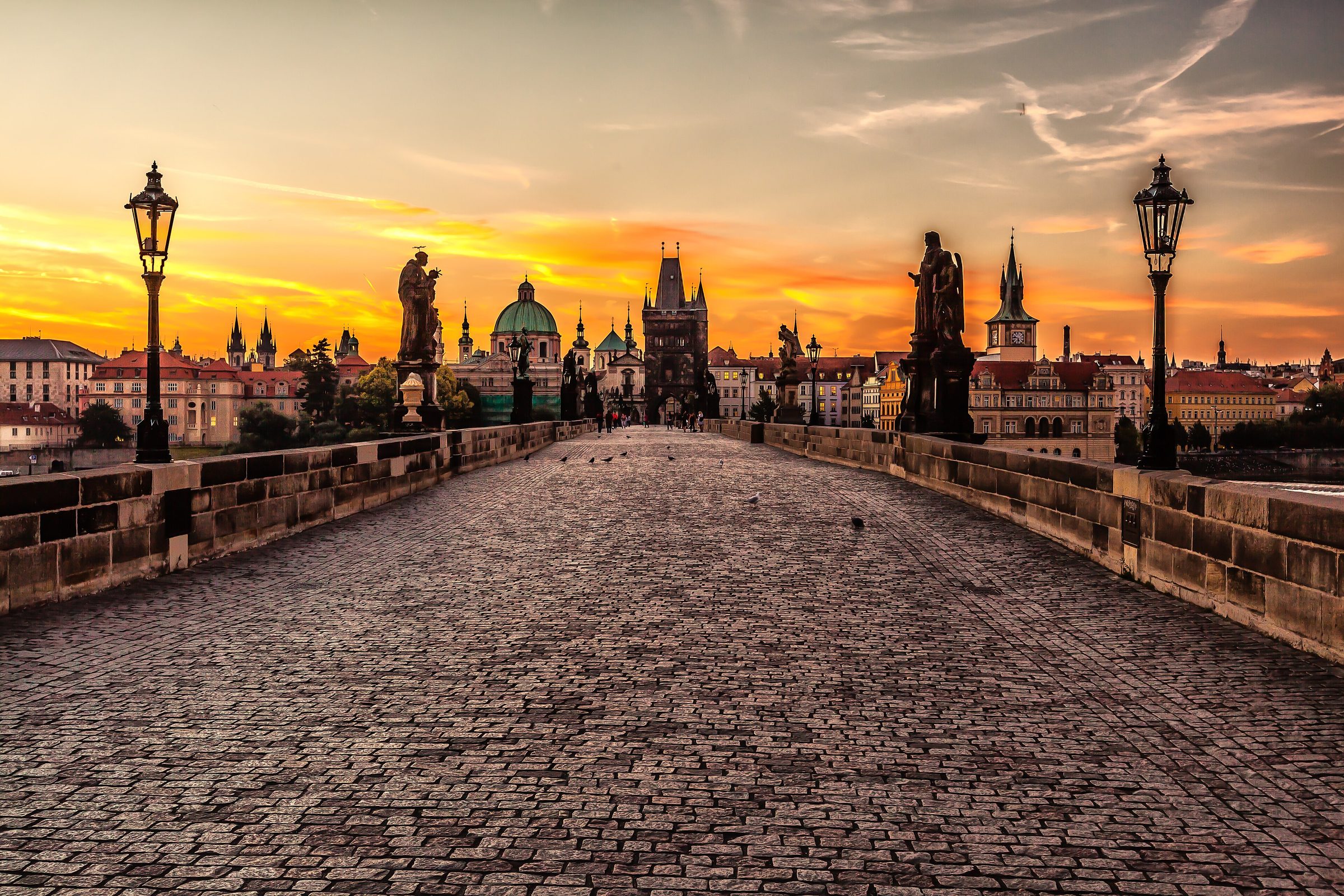 Sunrise on the empty Charles Bridge in Prague