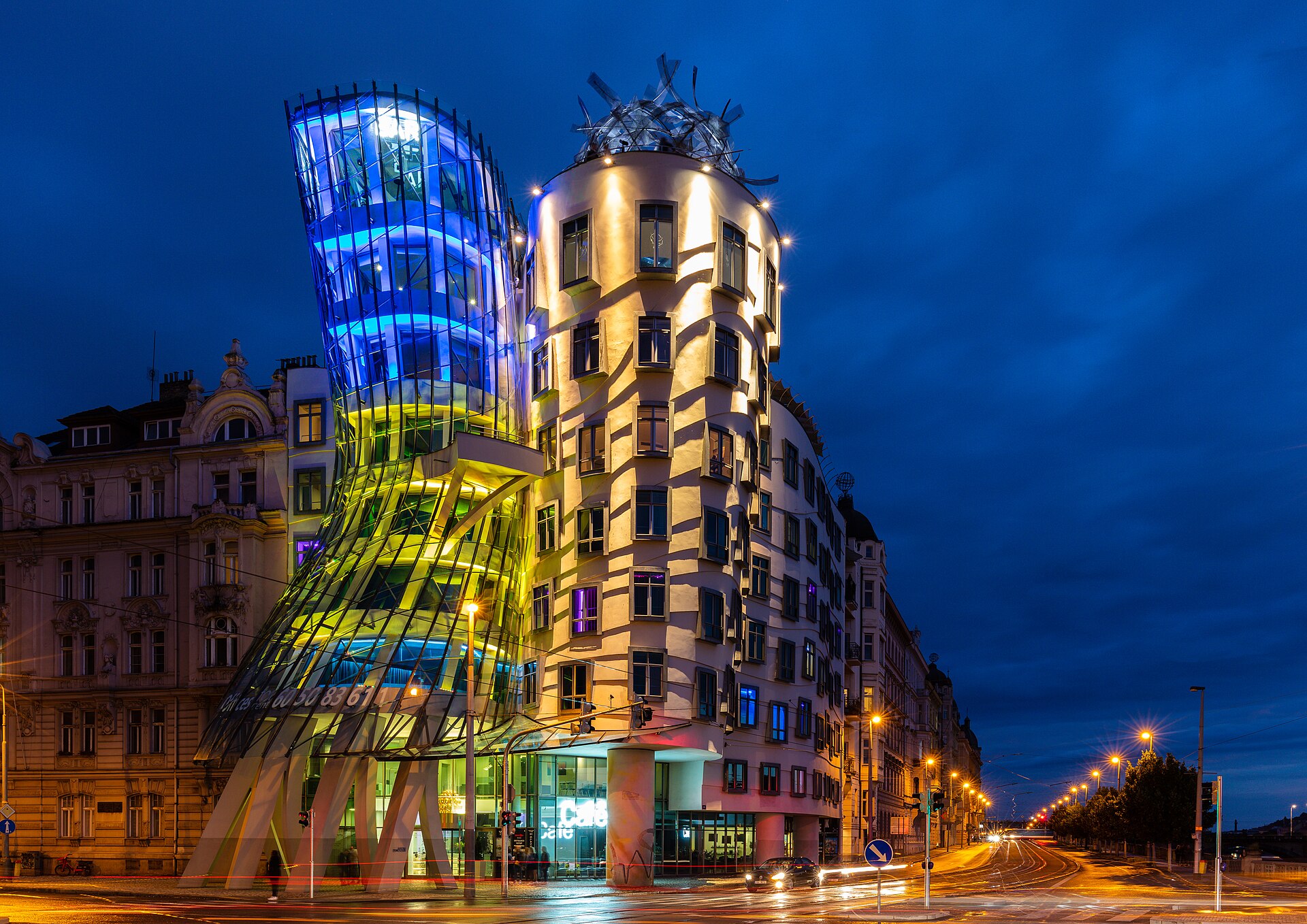 The Dancing House lit at night