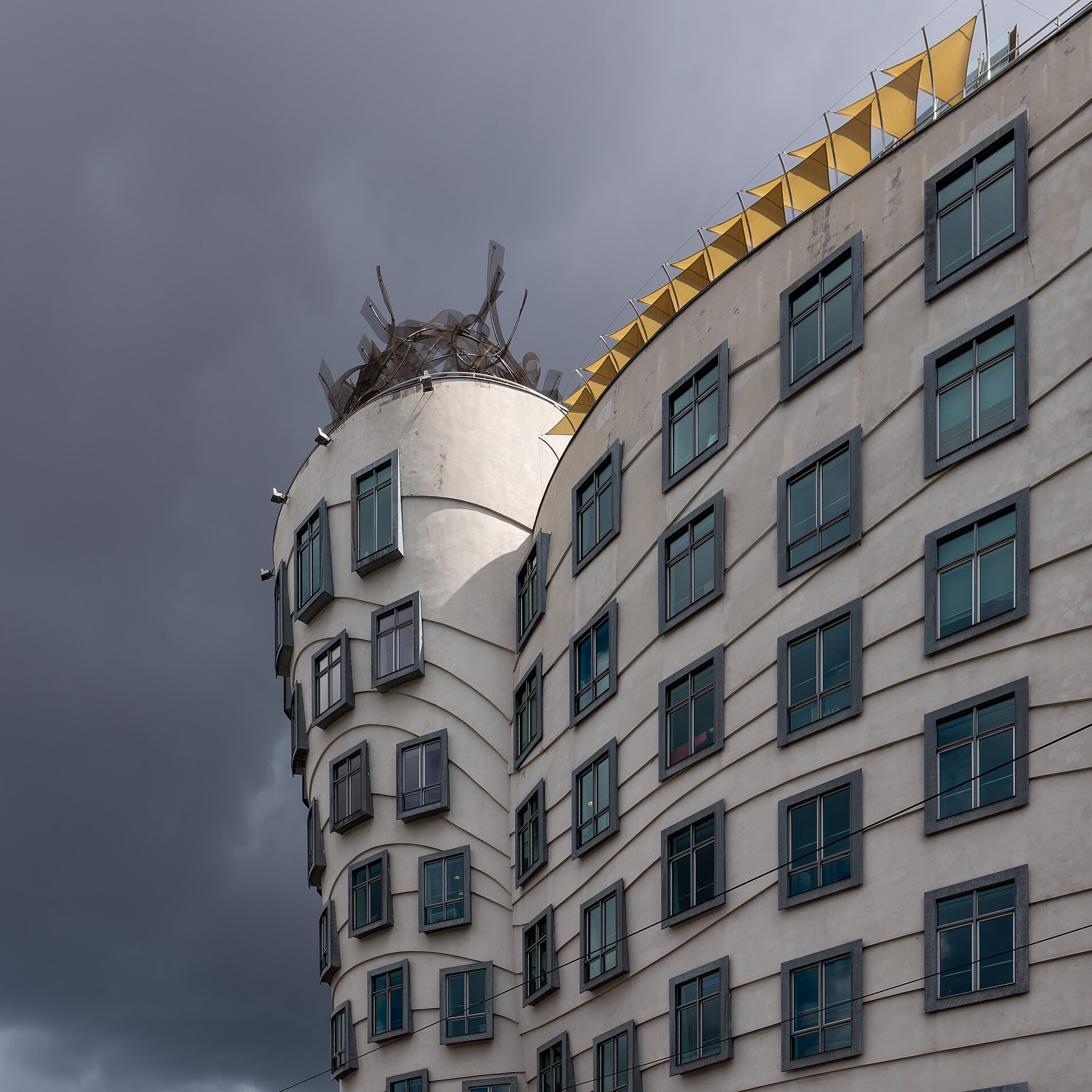A detail of the Dancing House facade