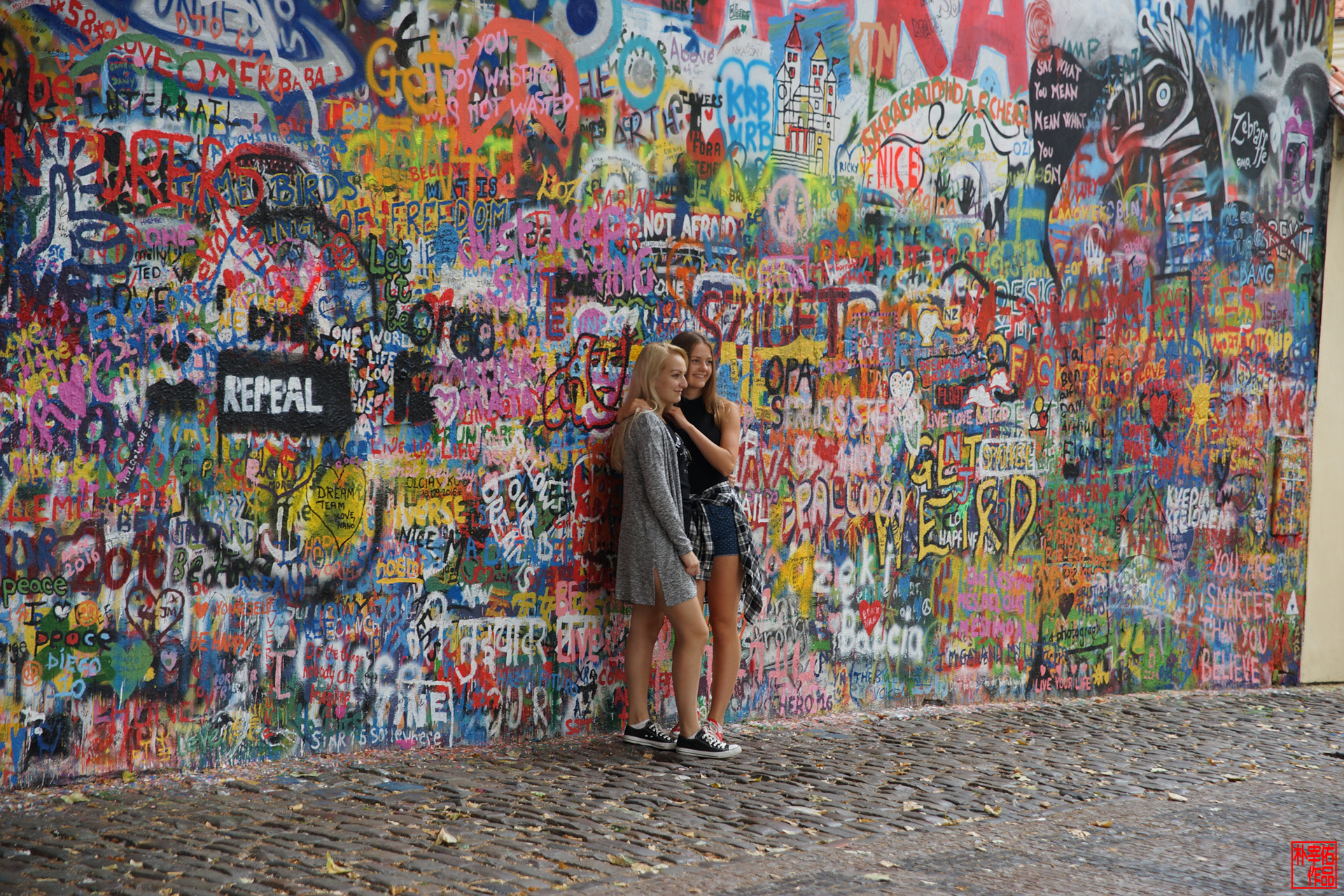 A visitor at the Lennon Wall